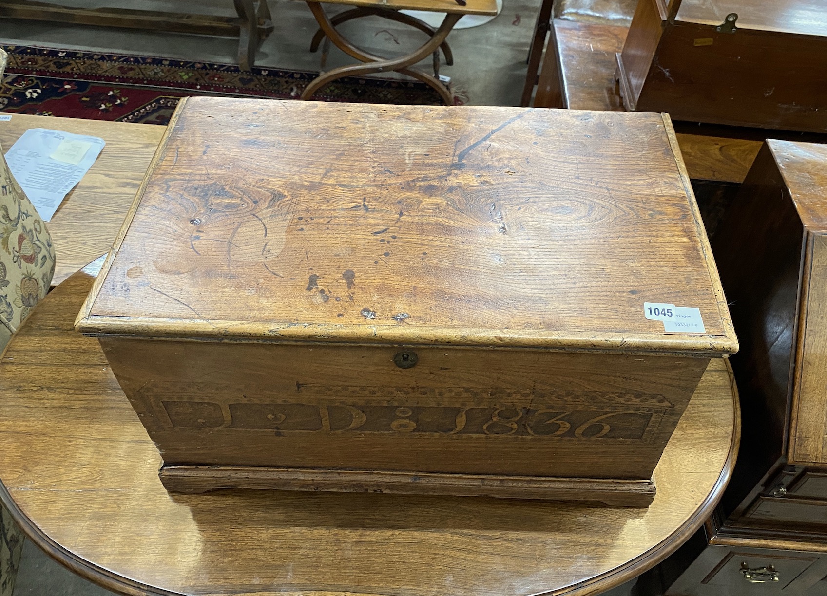 A small 19th century elm chest, the front with carved monogram JD and dated 1836, width 66cm, depth 40cm, height 38cm